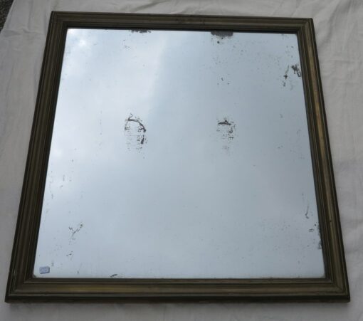 Old mercury mirror with brass frame