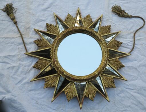 Miroir en étoile,bois doré et miroir oxydé