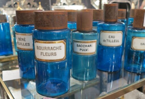 The Lot of jars of blue glass pharmacopoeia and porcelain stickers