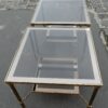 1970' Pair of side tables in gilt metal with trays in smoked glass, 61X 61 cm