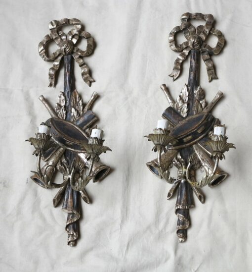 1950/70 Pair of sconces  silvered wood  has the music instruments drum and trumpets