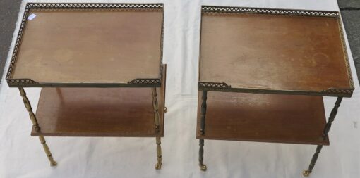 Side table pair has castors in brass with gallery Maison Bagués