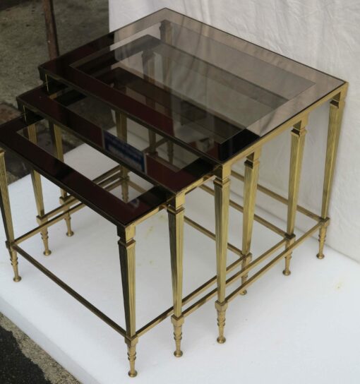 1950/70 Series of 3 Nesting gilted bronze tables top smoked glass silvered frame