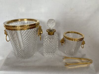 1970 'Champagne Bucket, Ice Cubes and Diamond Point Crystal Bottle With Gilt Bronze Lion Heads